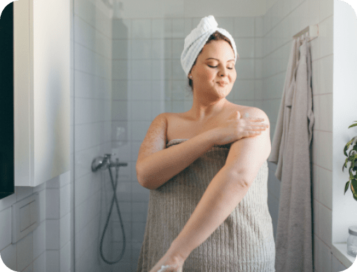 Woman practicing self after taking a shower
