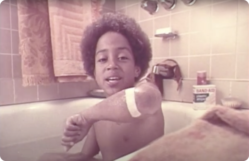 Snapshot of mother bathing sun in BAND-AID® Brand commercial jingle